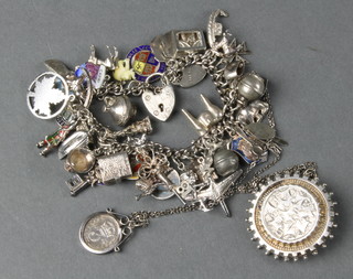 A Victorian silver brooch, a silver charm bracelet and minor silver jewellery 