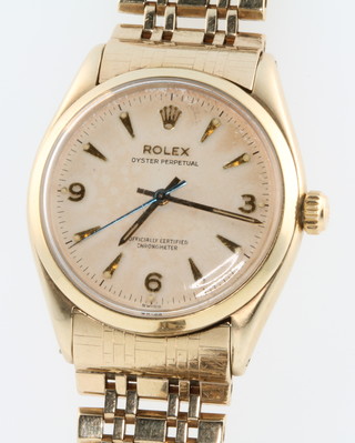 A gentleman's Rolex Oyster perpetual 9ct gold wristwatch on a ditto bracelet with Rolex clasp 