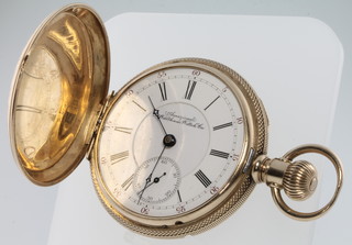A gentleman's 14ct gold cased hunter pocket watch with fancy engraved case with seconds at 6 o'clock, the dial inscribed American Waltham Watch Co. 