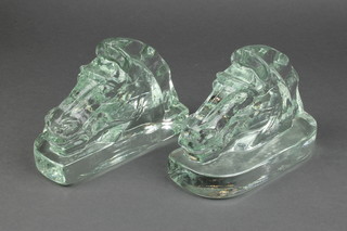 A pair of stylish soda glass horse head bookends 7"