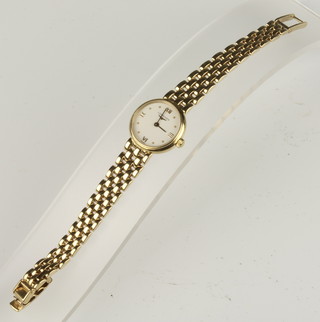 A lady's Longines 18ct yellow gold wristwatch on a ditto bracelet with Longines clasp, in original box with paperwork 