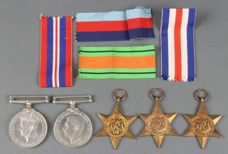 Group 1939-45, Africa and France Germany Stars, Defence and War medals with posting box and part issue slip to Flt.Sgt. G.J.W.Lucas 
