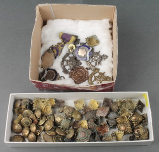 A quantity of Second World War and later buttons etc including 3 silver sports fobs, an Oddfellows medallion 