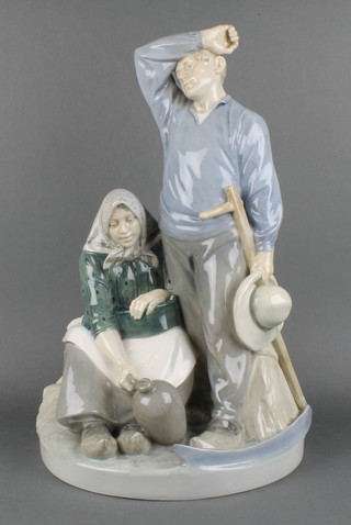 A Royal Copenhagen  Harvest Group of a weary farm worker and his seated wife 1352 (1944-49) 17" 