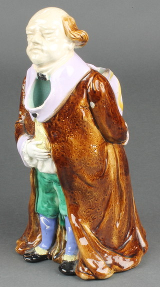 A 19th Century Majolica jug in the form of a standing man 11"