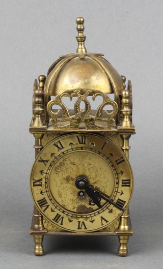 A Smiths reproduction lantern clock with 3" brass dial contained in a brass case 