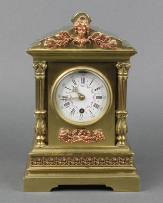 A 19th Century French 8 day timepiece with enamelled dial and Roman numerals contained in a gilt metal case 