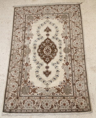 A white ground Persian Kashan rug with central medallion 82" x 52" 