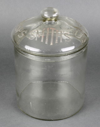 A Smiths Potato Crisps cylindrical glass jar and cover, the lid etched Smiths Crisps 9"h