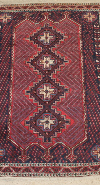 A red and blue ground Persian Afshar rug with 4 stylised diamonds to the centre 82" x 60" 