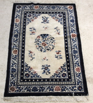 A 1930's blue and white Chinese rug 72" x 48"