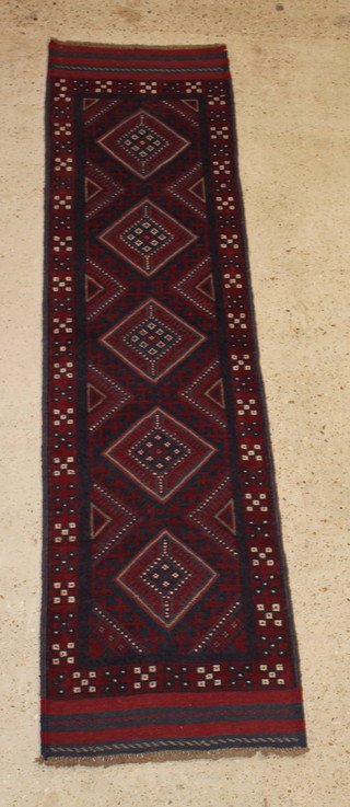 A contemporary red and blue ground Meshwani runner with 5 diamonds to the centre 103" x 26" 
