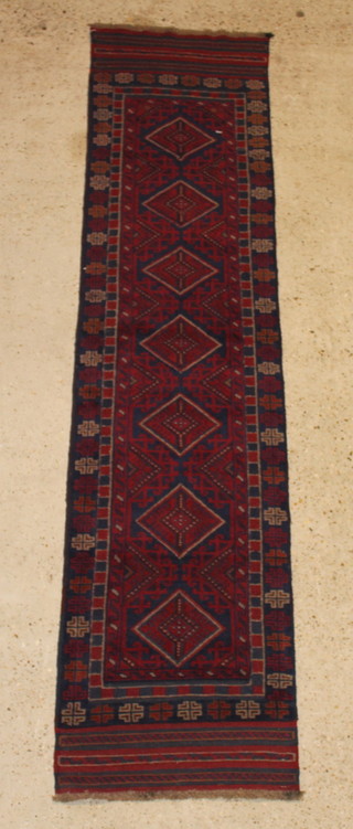 A contemporary red and blue ground Meshwani runner with 7 diamonds to the centre 106" x 24" 