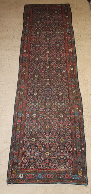 A red and floral patterned Persian Bakhtiar runner 165" x 44" 