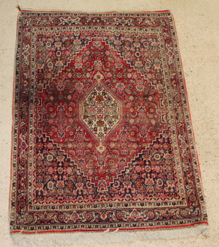 A Persian Bidjar red and blue ground rug with diamond to the centre 65" x 45 1/2 