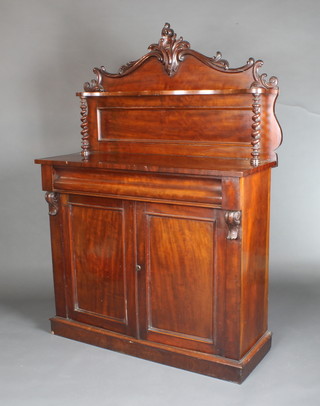 A Victorian mahogany chiffonier with raised and shaped back and with spiral turned columns to the side, the base fitted a secret drawer above double cupboard with vitruvian scrolls to the sides, raised on a platform base 59"h x 42"w x 16 1/2"d  