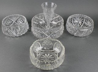 A cut glass waisted vase 8 1/2", a circular cut glass bowl 9", 2 other bowls 8" and a moulded glass bowl 8" 