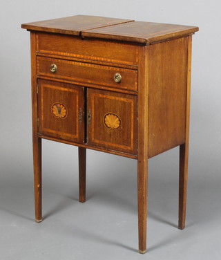 A rectangular Edwardian inlaid mahogany sewing cabinet with hinged lid and fitted interior, the base fitted 1 long drawer with cupboard enclosed by panelled door, raised on square tapering supports 31"h x 22"w x 13 1/2"d 