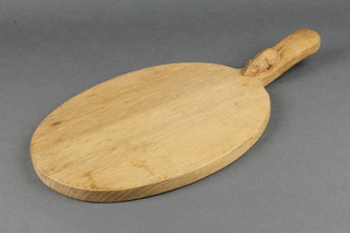Robert Thomson, a carved oak Mouseman cheese board, the handle decorated a mouse's tail  16" x 8" 