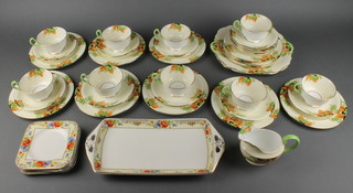 A 37 piece Aynsley pattern tea service comprising 2 bread plates, 12 tea plates 7" (1 cracked), 12 saucers, cream jug, 9 tea cups (4 cracked) together with a 6 piece Bursley ware sandwich set with floral decoration 