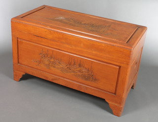A rectangular carved camphor coffer with hinged lid, the interior fitted a tray  23"h x 40"w x 20"d 