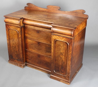 A Victorian mahogany inverted breakfront sideboard with raised shaped back, the centre secret drawer fitted a reading fack flanked by 2 secret drawers above 3 long drawers flanked by cupboards enclosed by arched panelled doors 38"h x 46"w x 22"d 