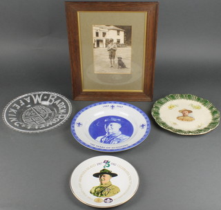 An Edwardian pressed glass plate The Relief of Ladysmith, marked Baden Powell, a plate decorated Baden Powell, 2 Scouting Centenary plates and a photograph of Baden Powell and dog 