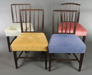 A set of 4 19th Century mahogany stick and rail back dining chairs with over stuffed seats, raised on square tapering supports with H framed stretchers 