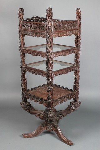 A Chinese carved and pierced hardwood square 4 tier display stand with carved finials in the form of a lizard with mice etc, raised on an X framed base supported by dragons 54"h x 17"w x 17"d 