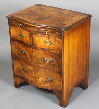 A Queen Anne style figured walnut bachelor's chest with crossbanded and quarter veneered top fitted a brushing slide above 2 short and 2 long drawers on bracket feet 28"h x 25"w x 17"d 