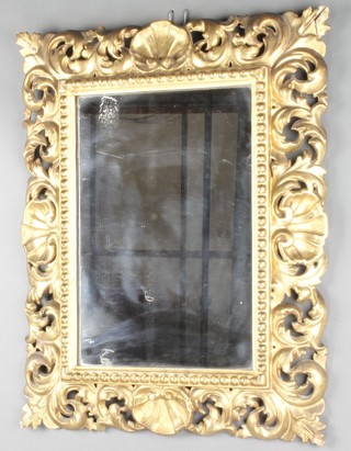 A 19th Century rectangular plate wall mirror contained in a pierced carved gilt wood frame 22"h x 17"w