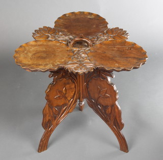 A Burmese carved hardwood leaf shaped occasional table, raised on a folding stand 19"h x 20"w x 20"d 