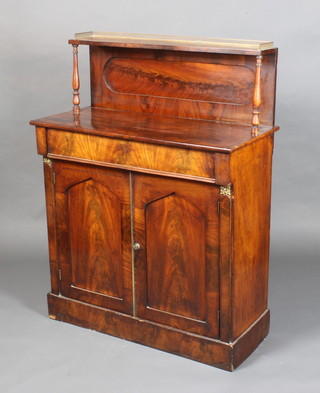A 19th Century mahogany chiffonier with raised back and brass gallery, having columns to the side, fitted 1 long drawer above a pair of arched panelled doors, raised on a platform base 49"h x 36"w x 16"d 