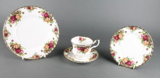 A 63 piece Royal Albert Old Country Rose patterned tea service - 5 dinner plates, 6 side plates (2 with contact marks), 12 tea plates, 6 bowls, bread plate, 2 sugar bowls, egg cup (chip to base), rectangular butter dish and cover, circular bread plate, teapot, 2 cream jugs, 12 saucers, 12 cups (1 cracked)
