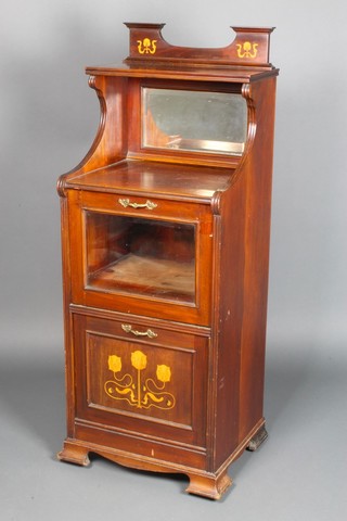 An Art Nouveau inlaid mahogany music cabinet with raised back and bevelled plate panelled door, fitted 2 cupboards enclosed by a glazed panelled door above a purdonium, raised on ogee bracket feet 48"h x 18"w x 15 1/2"w 