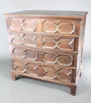 A Jacobean oak chest of 4 long drawers with geometric mouldings and brass drop handles, raised on bracket feet 41"h x 40 1/2"w x 23"d 