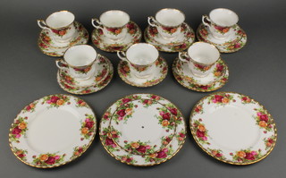 A collection of Royal Albert Old Country Rose teaware, 7 tea cups, 7 saucers, 6 side plates, 2 small plates, a 2 tier cake stand