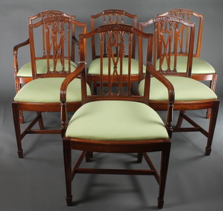 A set of 6 Hepplewhite style mahogany dining chairs with pierced rail backs and upholstered seats, raised on square tapering supports, spade feet, with H framed stretchers