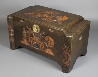 A Chinese carved camphor coffer with hinged lid, heavily carved throughout 22"h x 39"w x 21"d 