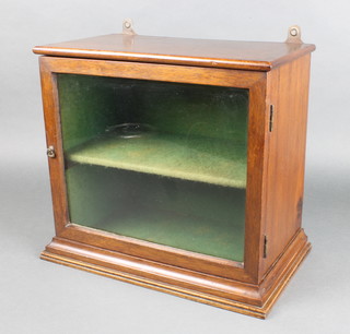 A 19th Century mahogany hanging cabinet with moulded cornice, fitted a shelf and enclosed by a glazed panelled door 12"h x 14"w x 8 1/2"d 