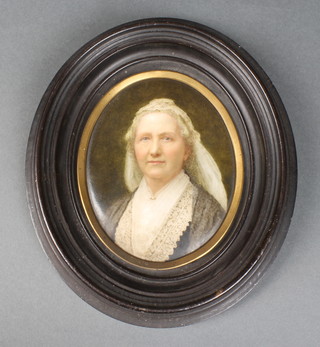 A 19th Century oval porcelain panel painted with a portrait of an elderly lady 4 1/4" x 3 1/4"