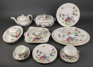 A Wedgwood cuckoo pattern extensive tea and dinner service comprising 10 tea cups, 8 saucers, 8 two handled bowls, 8 saucers, 14 small plates, 8 medium plates, 8 side plates, 8 dinner plates, 8 dessert bowls, a sugar bowl and lid, tea pot, a milk jug, 2 tureens and lids, 3 dishes and 2 meat plates 