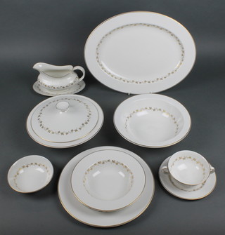 A Royal Doulton Citadel extensive dinner service comprising 12 two handled bowls, 10 saucers, 12 small plates, 12 side plates, 12 dinner plates, 12 dessert bowls, 6 deep bowls and covers, 3 deep bowls, 2 sauce boats, 2 sauce boat stand, 2 large and 2 medium size meat plates, 12 dessert bowls and 1 odd sauce boat stand