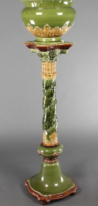 An early 20th Century Villeroy & Boch jardiniere and stand, the green ground with russet leaf decoration 54" 