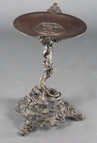 A 19th Century bronze twin handled table centrepiece, raised on an associated Rococo style pierced base 18"h x 11 1/2" diam. 