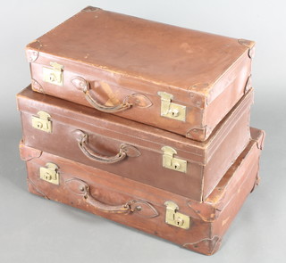 A brown leather suitcase with brass locks 8" x 28" x 17" together with 2 other brown leather suitcases with brass locks 8" x 26" x 15", 6 1/2" x 24" x 14" 