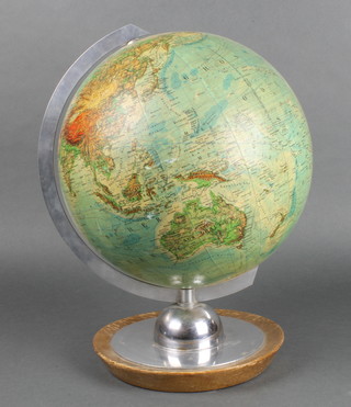 A JRO terrestrial globe raised on a chrome and wooden base 10" 