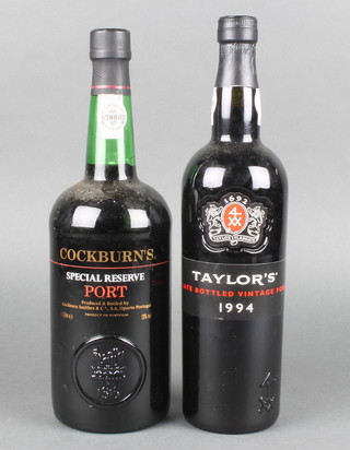 A bottle of 1994 Taylors late bottled vintage port together with a litre bottle of Cockburns Speical Reserve port 