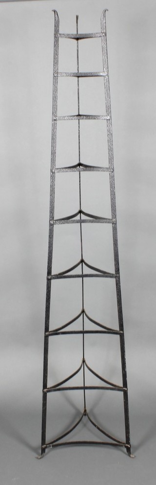 A Victorian graduated 9 tier triangular wrought iron pot stand 72"h x 11" at the base x 5" at the top 
