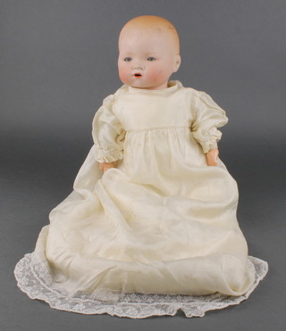 Armand Marseille, a porcelain headed baby doll with open and shutting eyes, open mouth with 2 teeth, the head incised AM Germany 